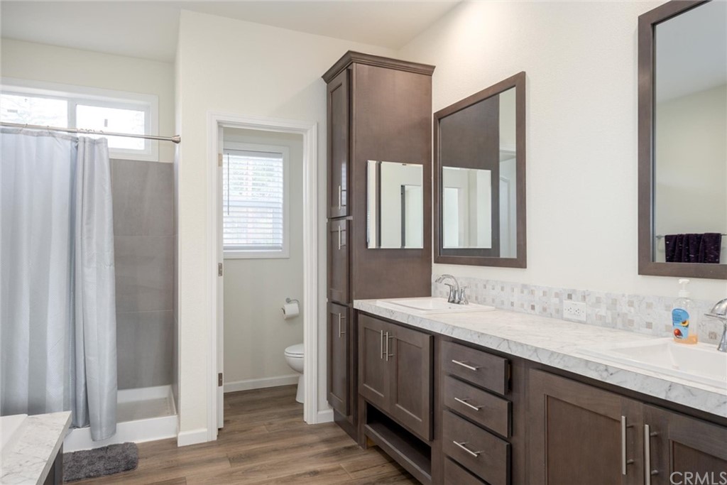 12980 Mohawk Way Concow, CA 95965 - Photo 17 of 26 a bathroom with a double vanity sink and mirror