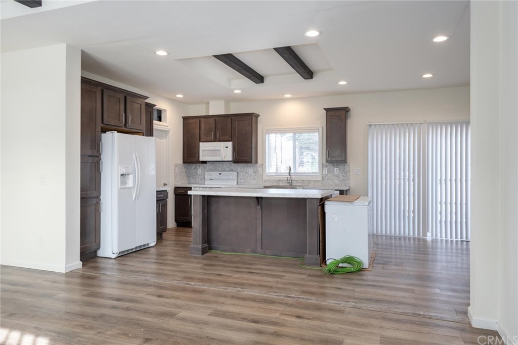 12980 Mohawk Way Concow, CA 95965 - Photo 9 of 26 a view of kitchen with refrigerator microwave and cabinets