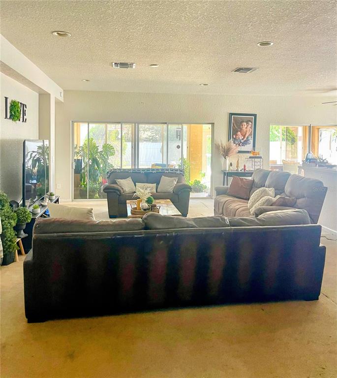 3921 Southwest 58th Avenue Ocala, FL 34474 - Photo 16 of 31 a living room with furniture window and a table