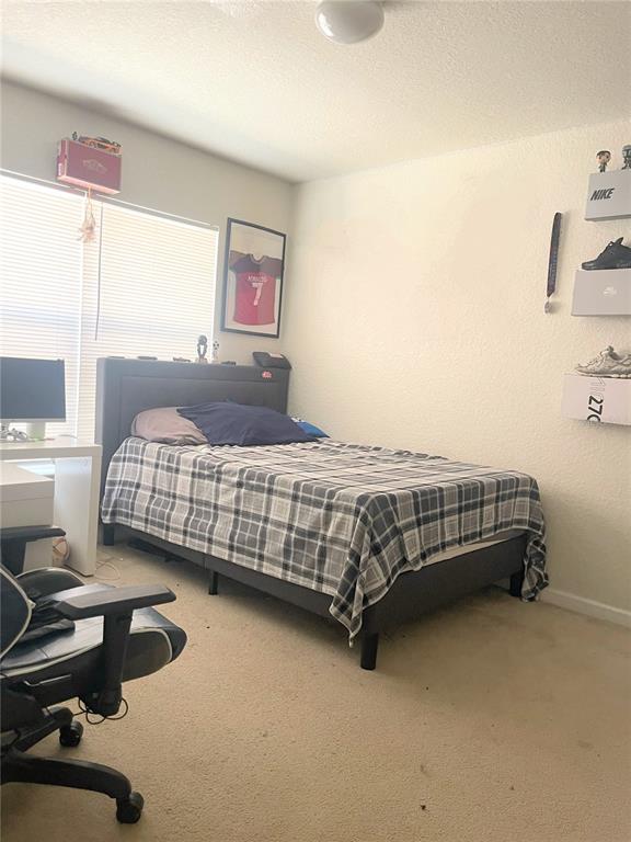 3921 Southwest 58th Avenue Ocala, FL 34474 - Photo 18 of 31 a bedroom with a bed and a desk