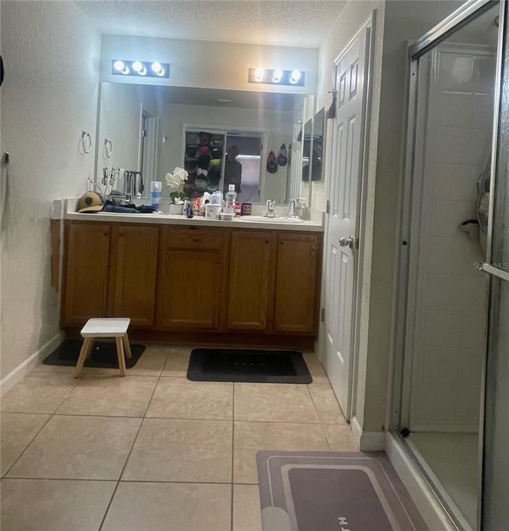 3921 Southwest 58th Avenue Ocala, FL 34474 - Photo 19 of 31 a bathroom with a sink a toilet and mirror