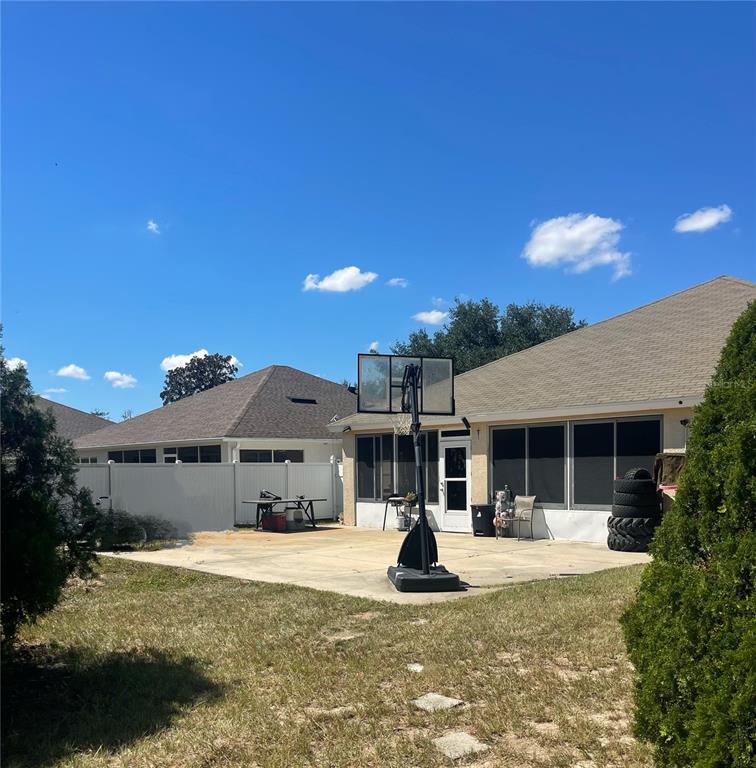 3921 Southwest 58th Avenue Ocala, FL 34474 - Photo 8 of 31 a front view of a house with a yard fountain and a tree