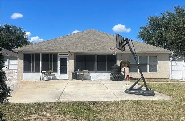 a house view with a sitting space and garden space