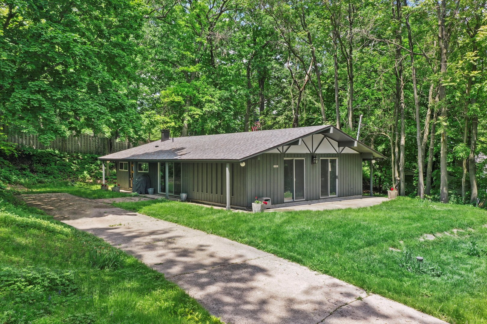 N1801 Birch Drive Linn, WI 53147 - Photo 1 of 33 a view of a big house in a big yard with large trees