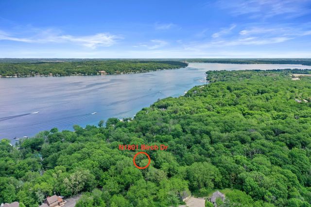 a view of a lake with a yard