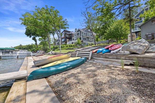 a view of backyard with swimming pool and outdoor seating