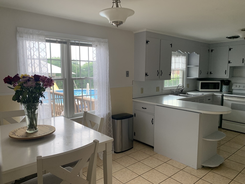 172 Maple Street East Longmeadow, MA 01028 - Photo 14 of 35 a kitchen with a sink appliances and a counter top space