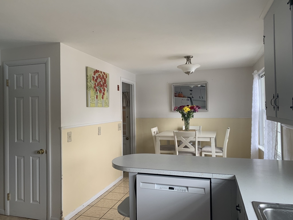 172 Maple Street East Longmeadow, MA 01028 - Photo 15 of 35 a view of a dining room with furniture and chandelier