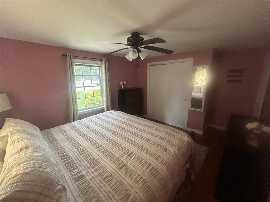 172 Maple Street East Longmeadow, MA 01028 - Photo 17 of 35 a bedroom with a bed and a chandelier