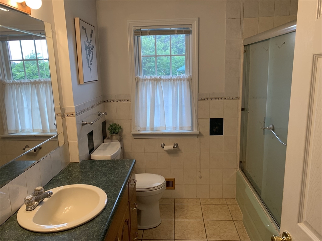 172 Maple Street East Longmeadow, MA 01028 - Photo 19 of 35 a bathroom with a sink toilet and mirror