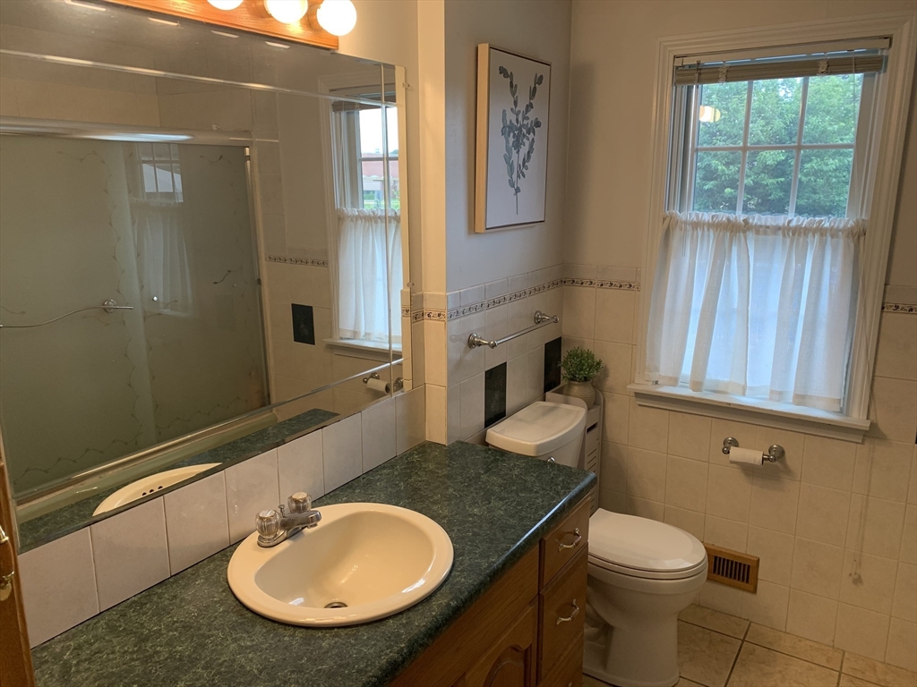 172 Maple Street East Longmeadow, MA 01028 - Photo 20 of 35 a bathroom with a granite countertop sink and a mirror