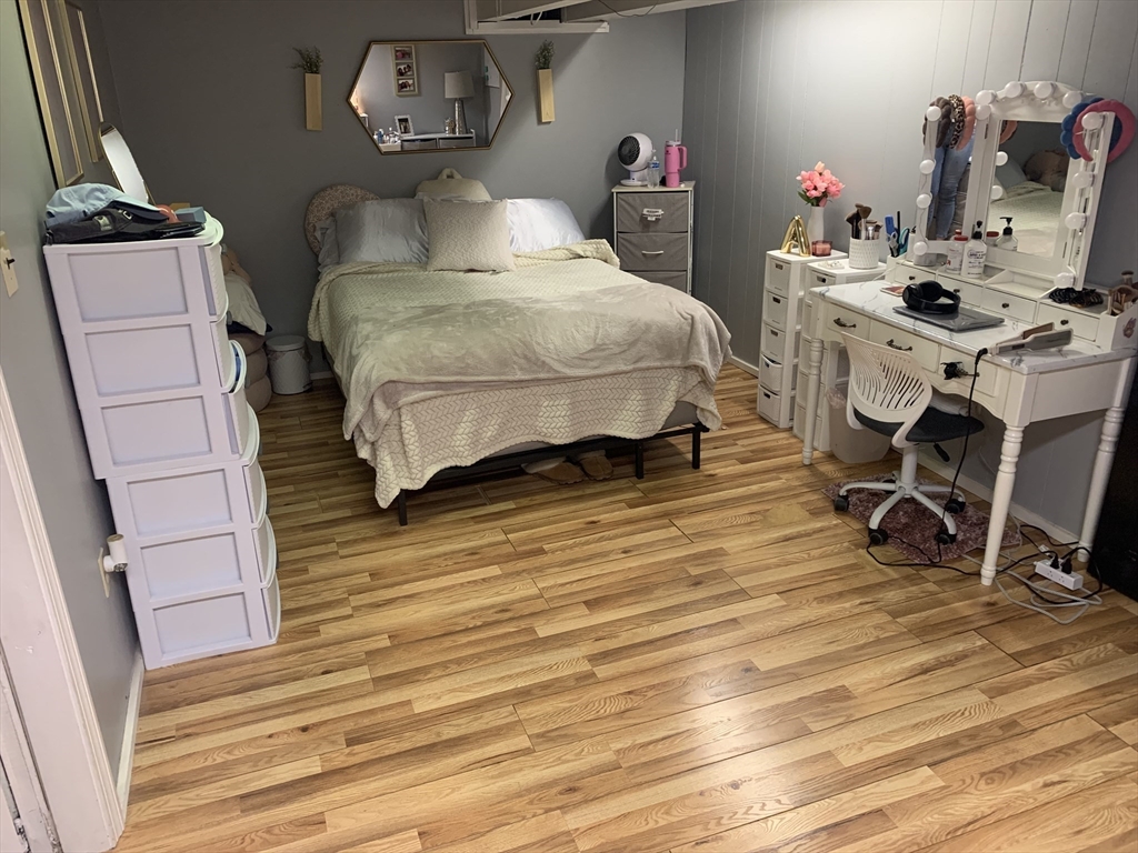 172 Maple Street East Longmeadow, MA 01028 - Photo 23 of 35 a bedroom with a bed and wooden floor