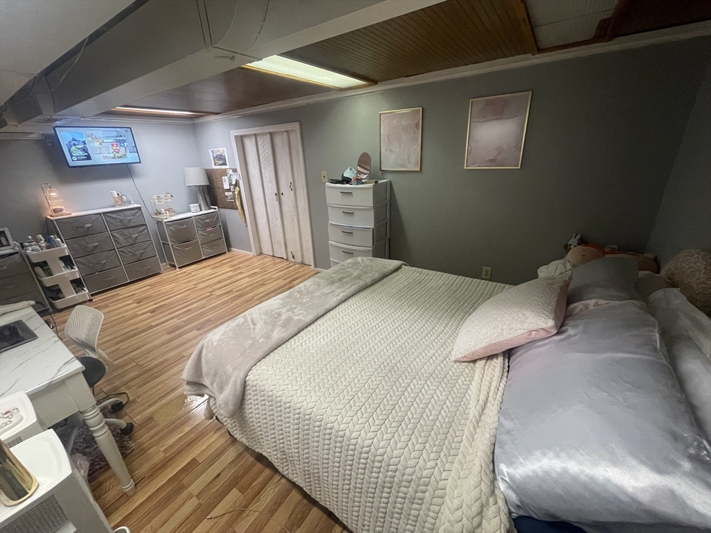 172 Maple Street East Longmeadow, MA 01028 - Photo 24 of 35 a bedroom with a bed and a refrigerator