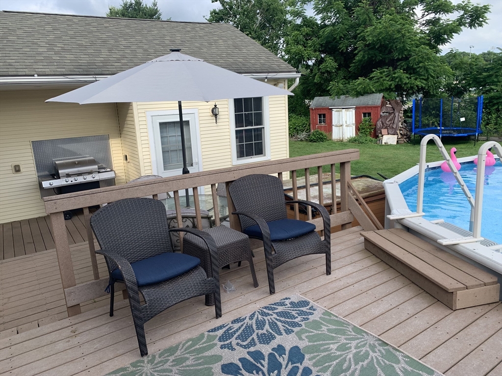 172 Maple Street East Longmeadow, MA 01028 - Photo 31 of 35 a roof deck with a table and chairs