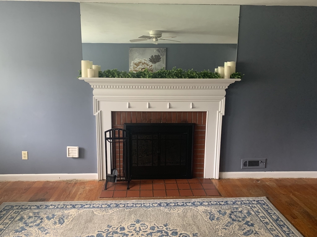 172 Maple Street East Longmeadow, MA 01028 - Photo 10 of 35 a living room with a fireplace and a fireplace