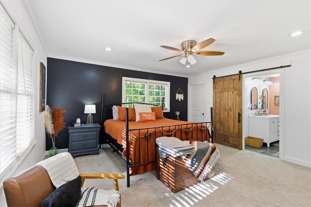 7 Thrushwood Road Northeast Rome, GA 30161 - Photo 13 of 37 a bed room with a bed and a couch