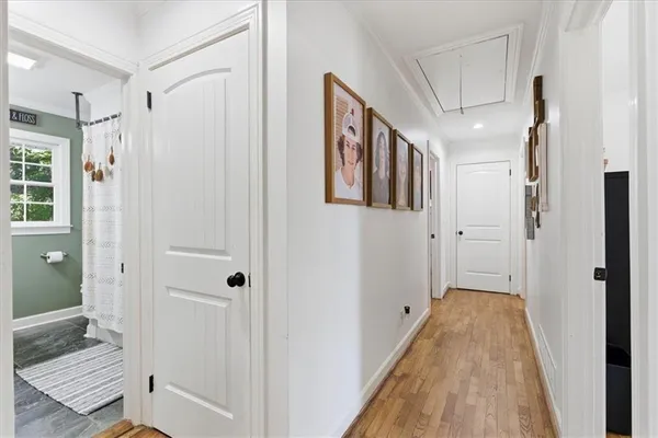 a spacious bathroom with a shower and a glass door