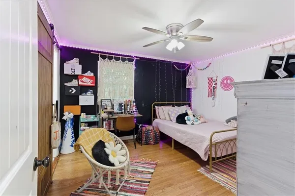a bedroom with furniture and a chandelier