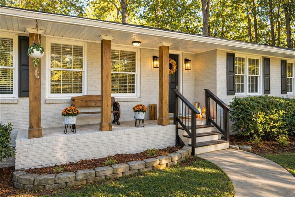 7 Thrushwood Road Northeast Rome, GA 30161 - Photo 2 of 37 a view of a house with backyard and sitting area