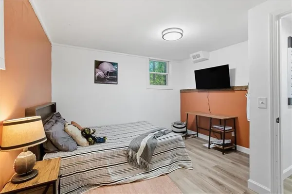 a room with a couch and a flat screen tv