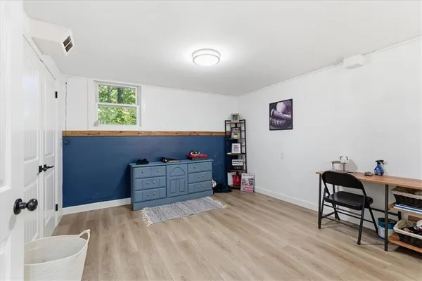 a room with furniture and a window