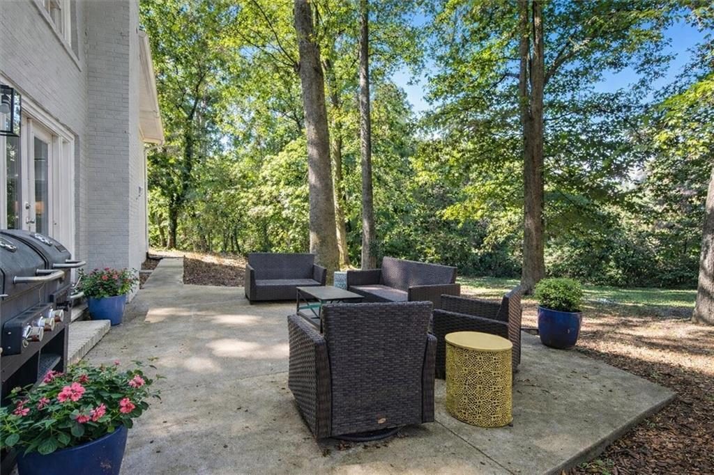 7 Thrushwood Road Northeast Rome, GA 30161 - Photo 33 of 37 a view of a backyard with sitting area