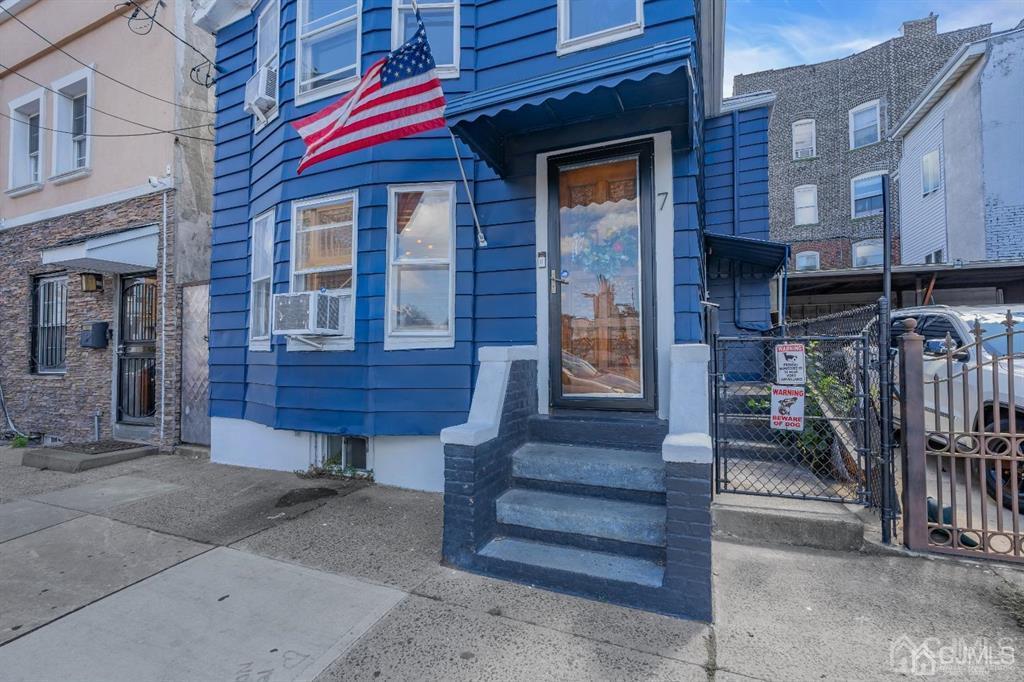 7 Downing Street Newark, NJ 07105 - Photo 2 of 18 a view of front door of house with stairs