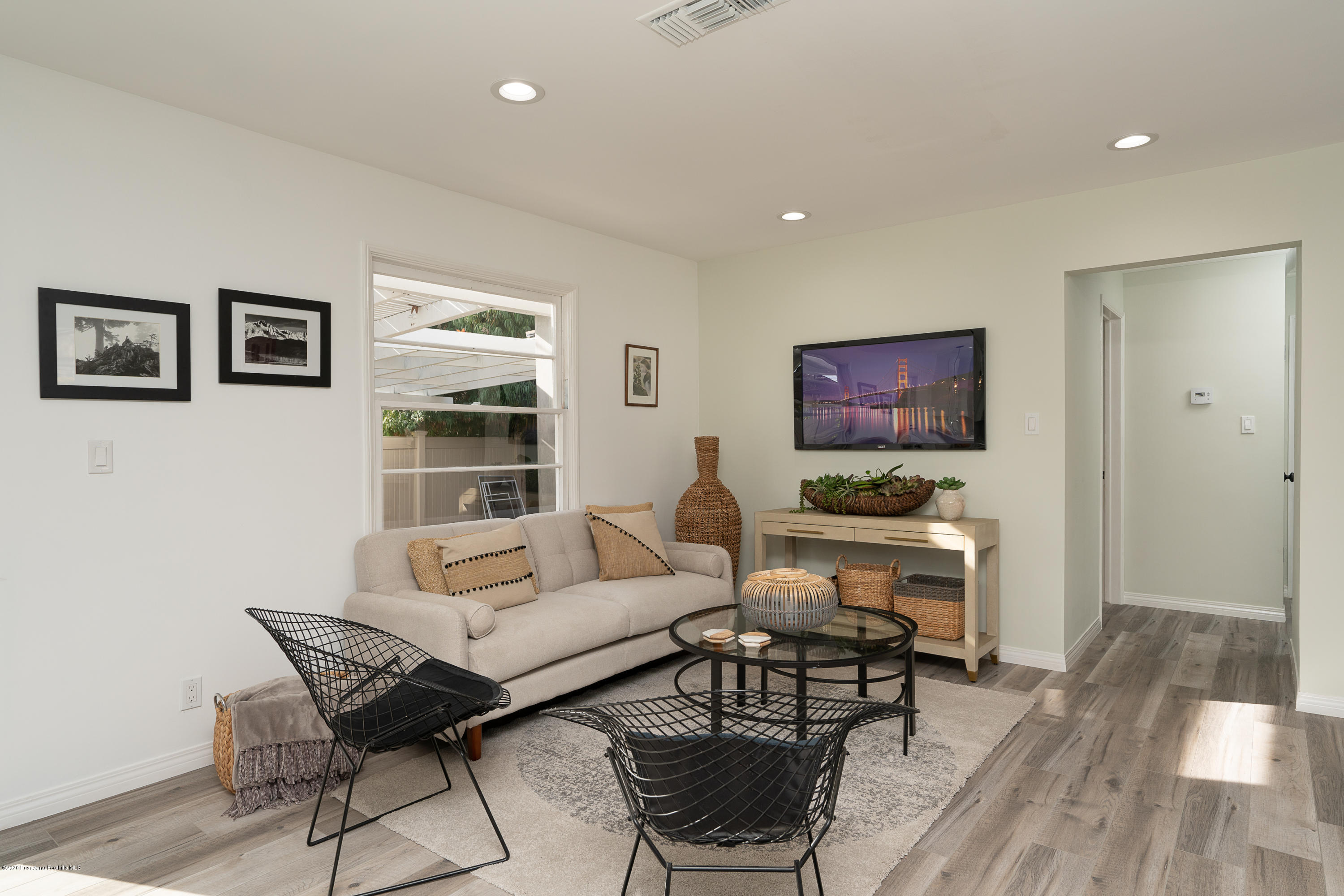 3248 George Circle Pasadena, CA 91107 - Photo 20 of 34 a living room with furniture a flat screen tv and a wall painting