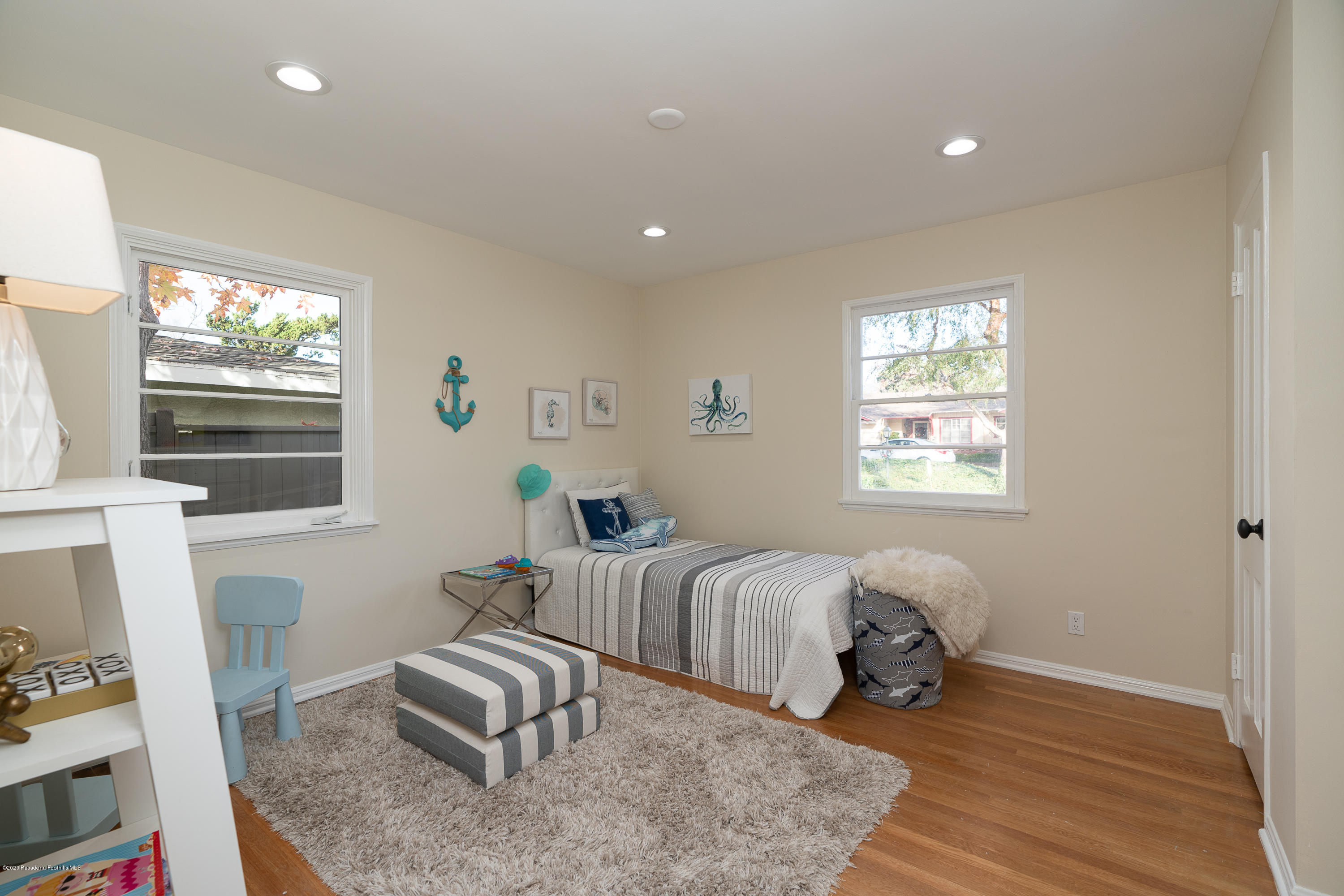 3248 George Circle Pasadena, CA 91107 - Photo 25 of 34 a spacious bedroom with a bed and a window