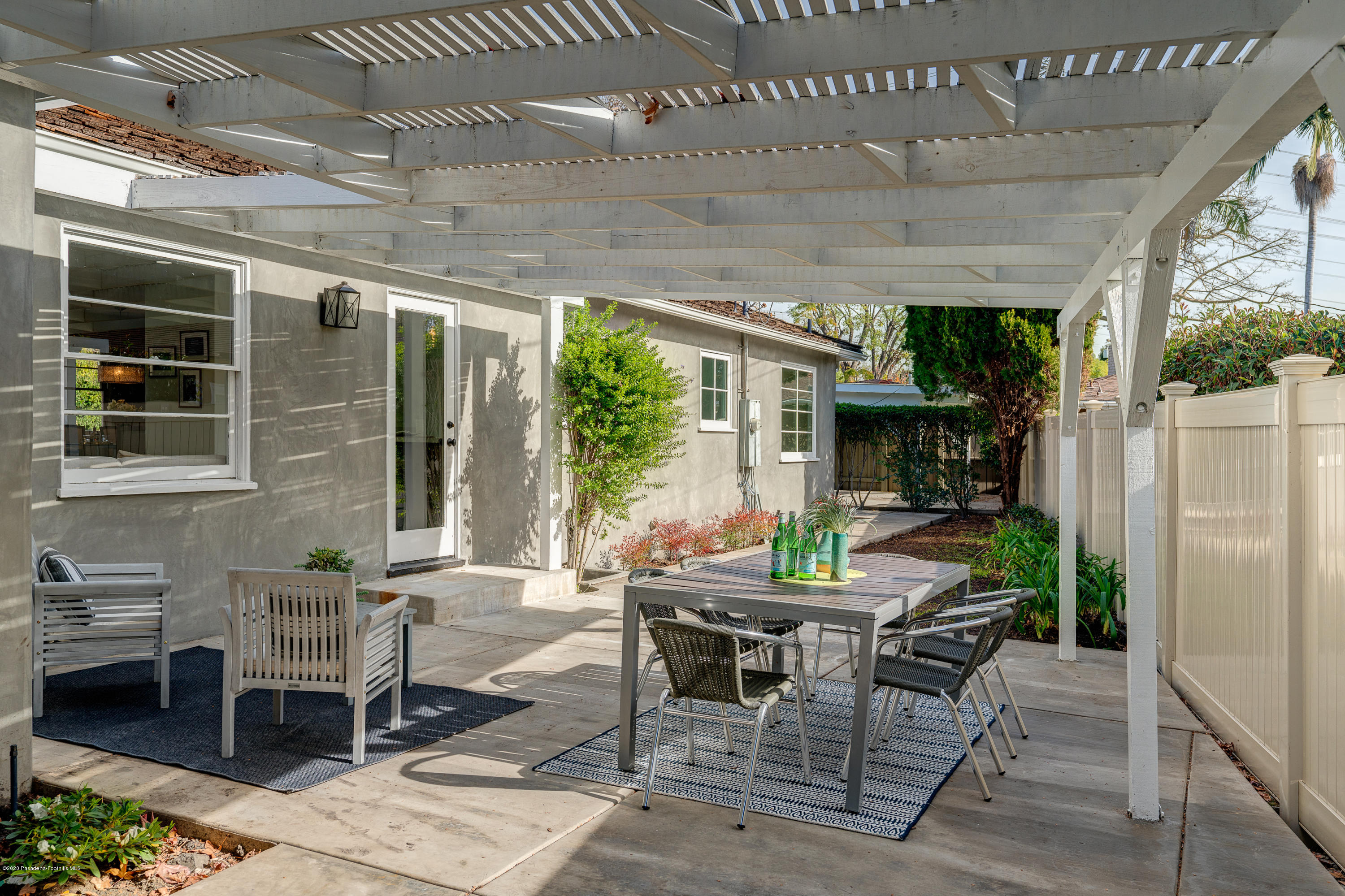 3248 George Circle Pasadena, CA 91107 - Photo 29 of 34 a view of a patio with table and chairs and potted plants