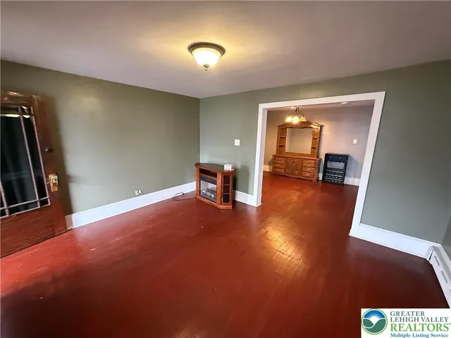 a kitchen with a refrigerator and a stove top oven