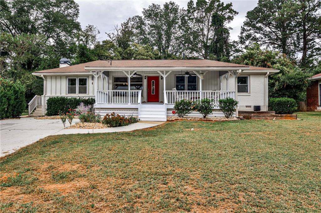 a front view of house with yard and outdoor seating