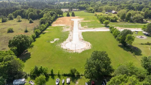 a view of a lake with a yard