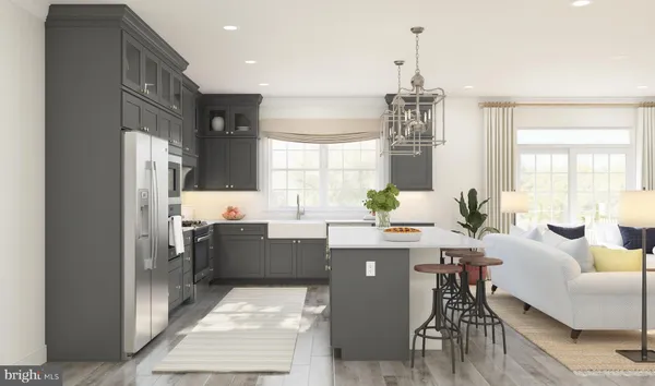 a room with kitchen island granite countertop furniture and a chandelier