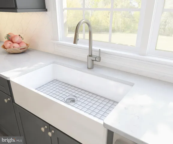 a bathroom with a sink and a window