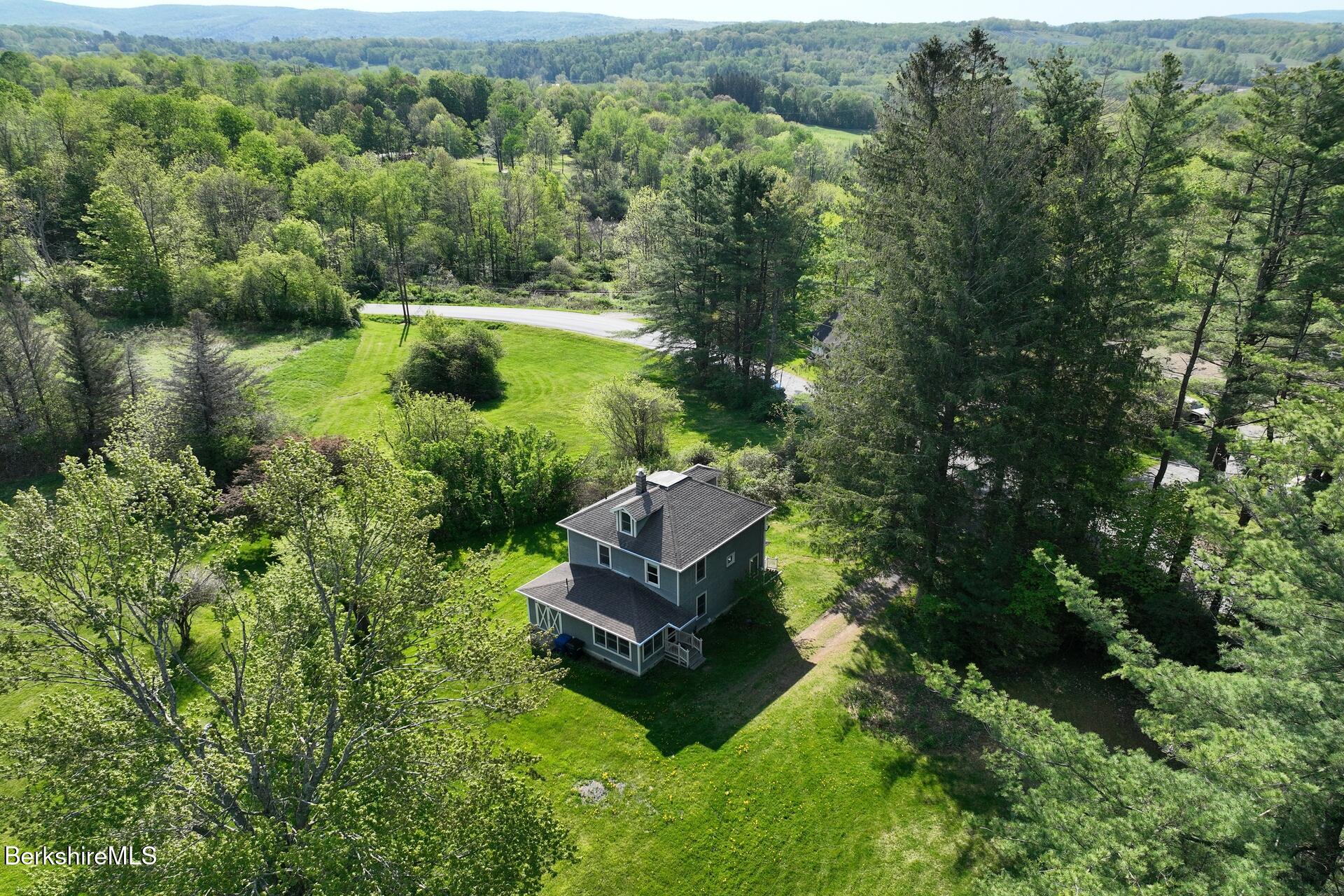 86 Miner Road Lanesborough, MA 01237 - Photo 14 of 44 an aerial view of a house with a yard
