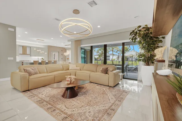 a kitchen with kitchen island a stove a table and chairs in it