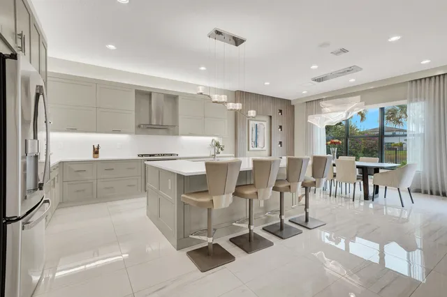 a kitchen with cabinets and stainless steel appliances
