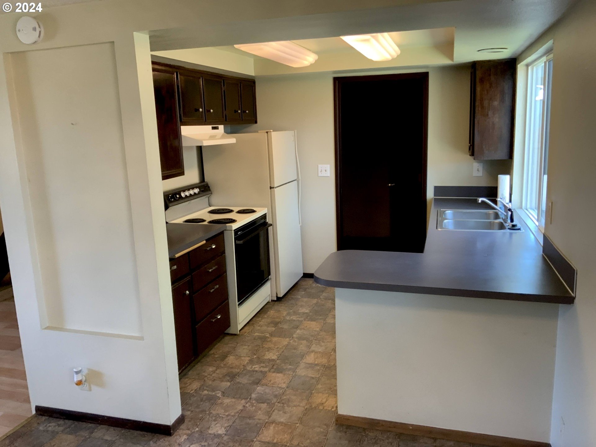 260 54th Street Springfield, OR 97478 - Photo 9 of 9 a kitchen with a refrigerator and a stove