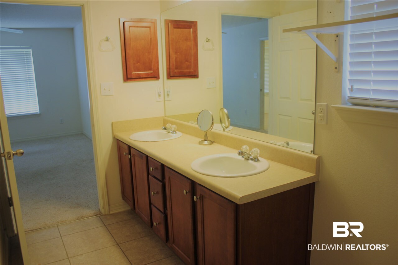 25407 Raynagua Boulevard Loxley, AL 36551 - Photo 20 of 20 Double vanity in master bath. Also has tub & showe