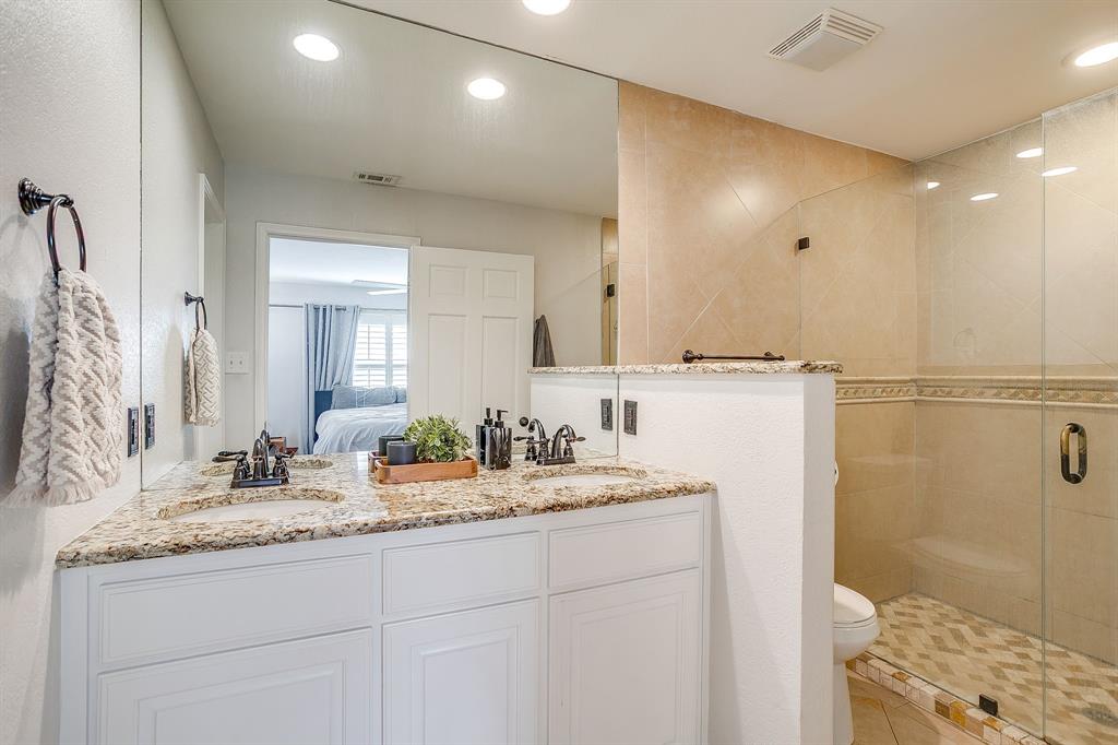 6504 Genoa Road Fort Worth, TX 76116 - Photo 22 of 40 Primary Bathroom with walk-in shower and closet