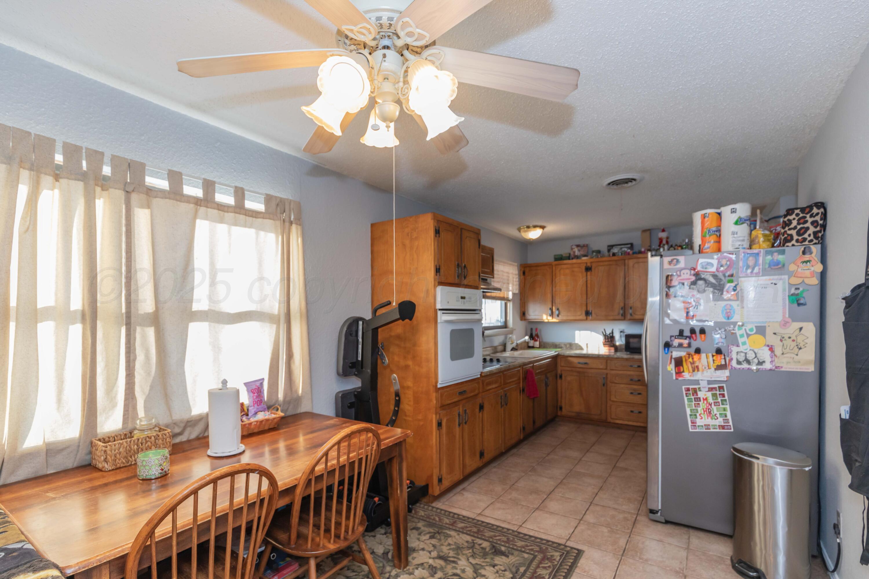 1208 Pecan Street Amarillo, TX 79107 - Photo 13 of 34 a very nice looking dining room with a large window and chandelier