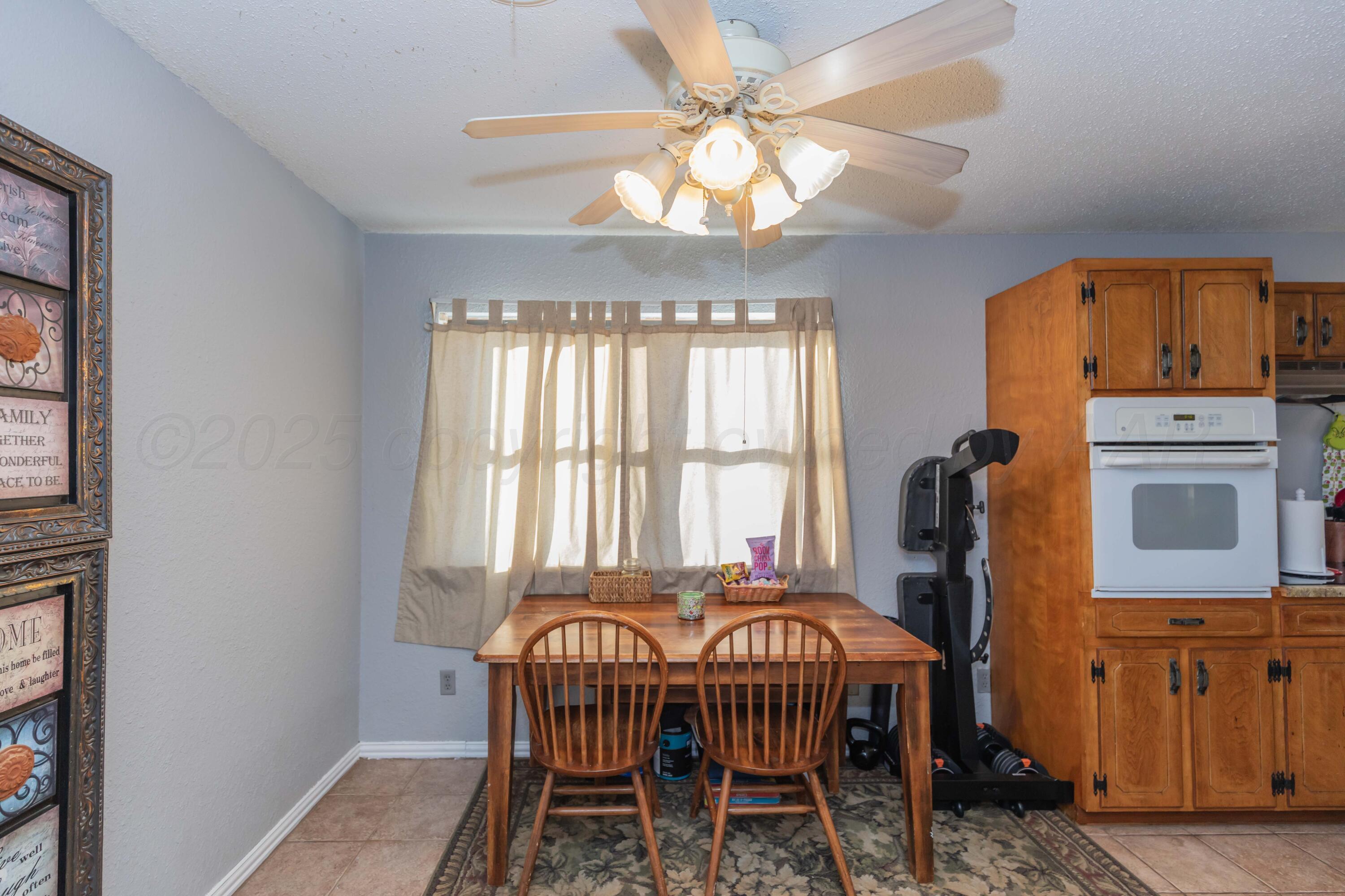 1208 Pecan Street Amarillo, TX 79107 - Photo 14 of 34 a dining room with furniture and window