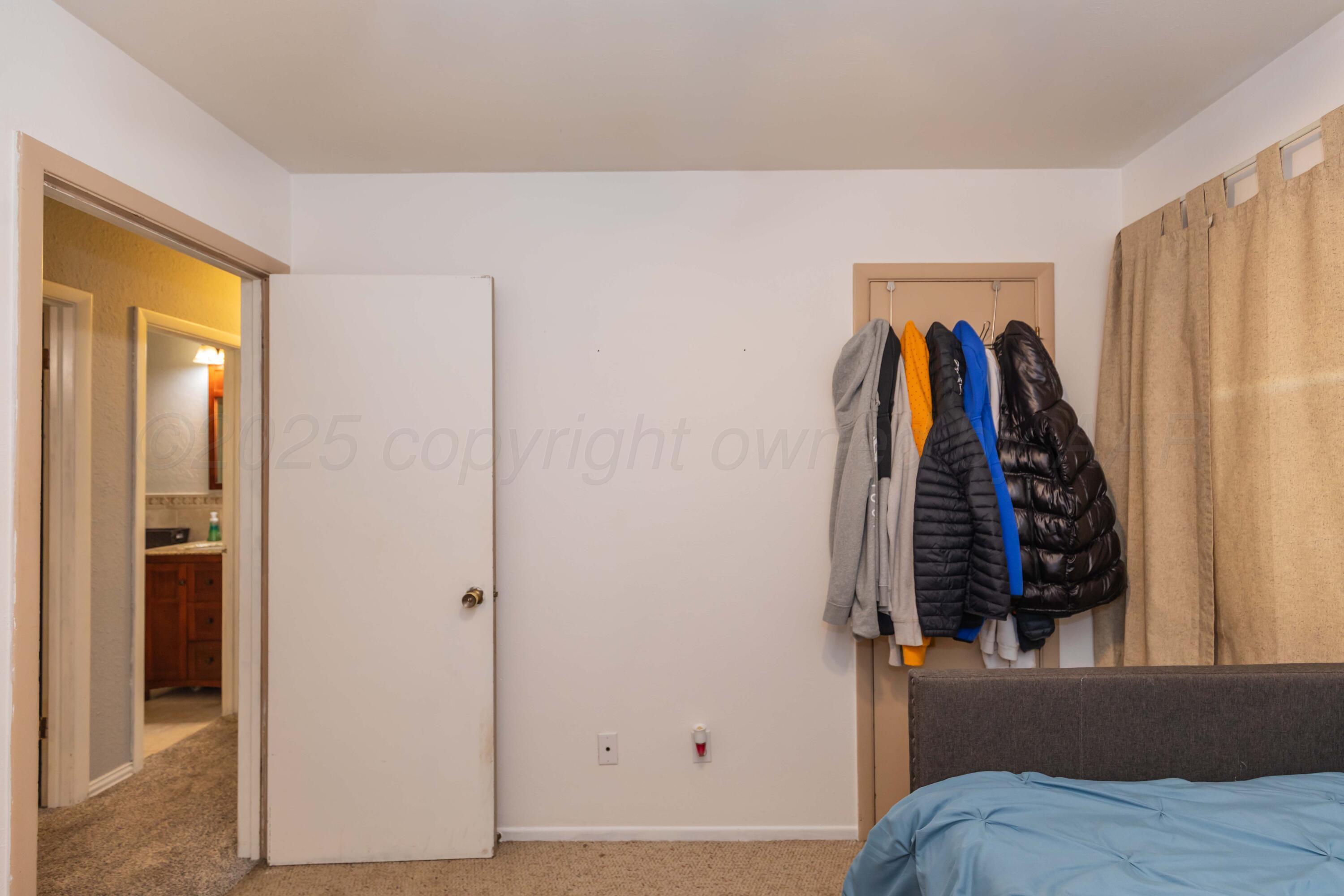 1208 Pecan Street Amarillo, TX 79107 - Photo 23 of 34 a view of walk in closet with clothes and shoes