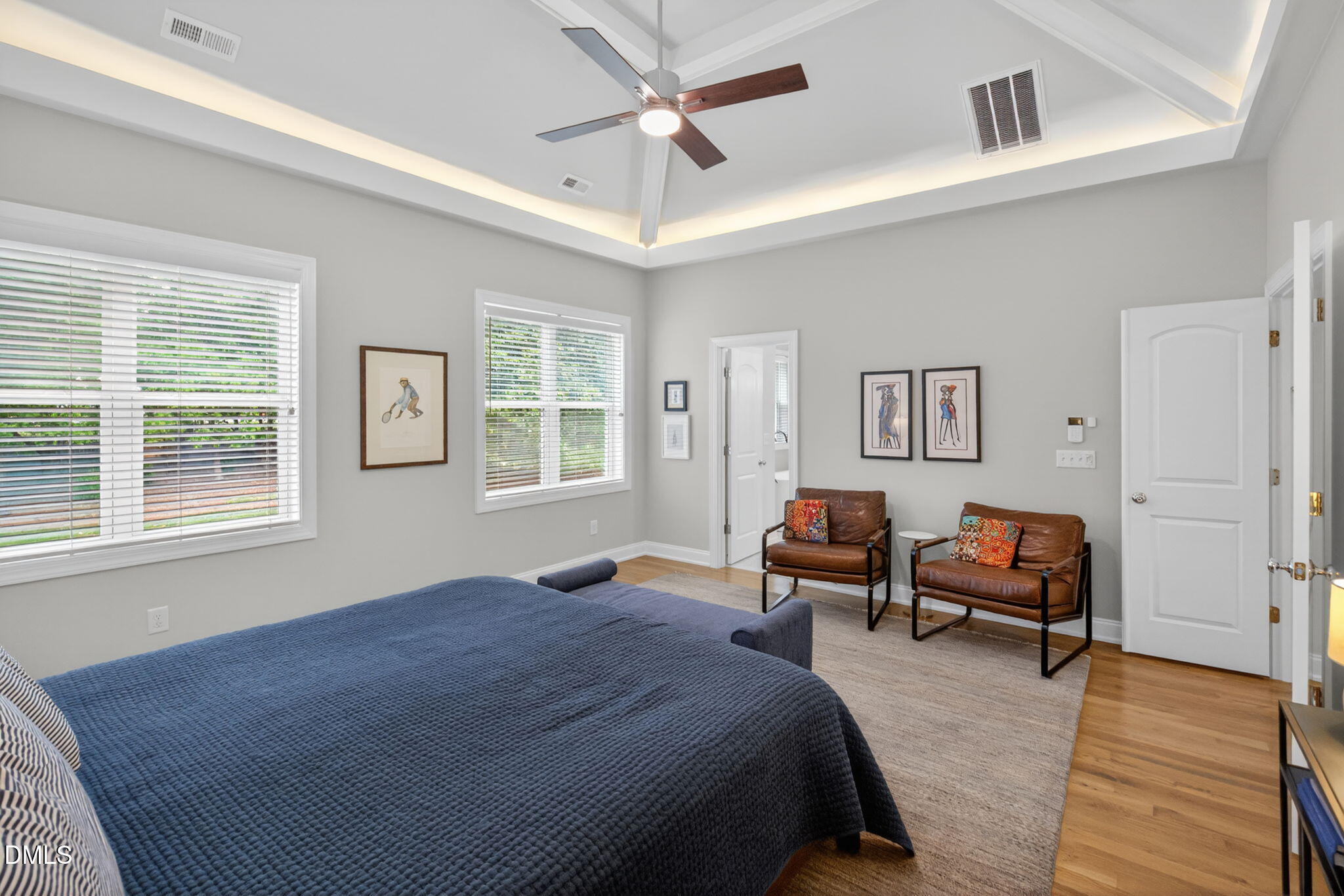 6901 Ray Family Farm Court Raleigh, NC 27613 - Photo 27 of 52 a bedroom with a bed and wooden floor