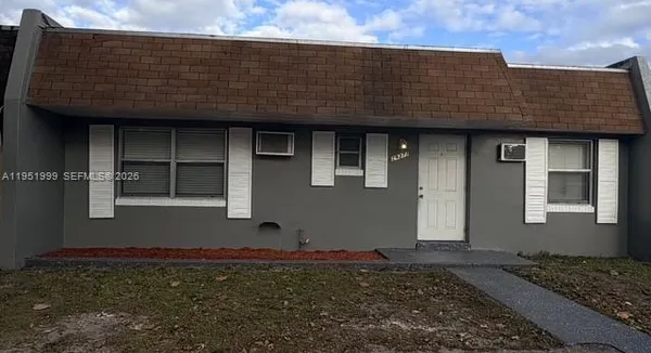 a kitchen with stainless steel appliances a refrigerator stove and microwave