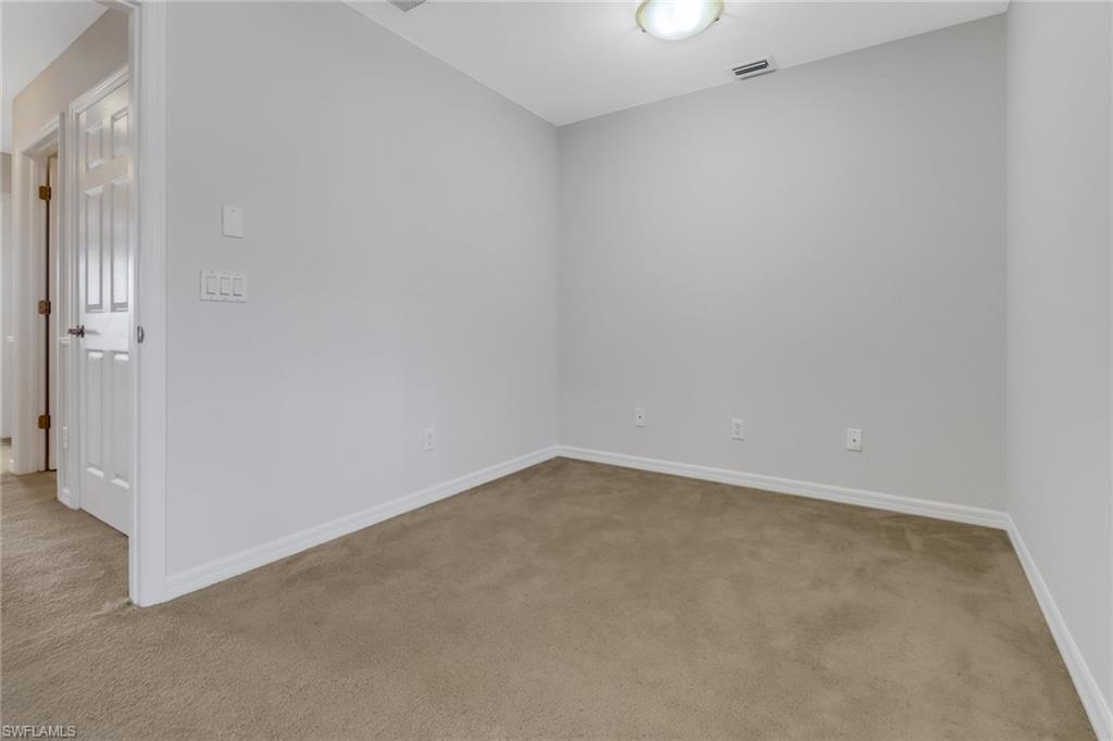20000 Heatherstone Way, Unit 3 Estero, FL 33928 - Photo 19 of 44 an empty room with an entryway