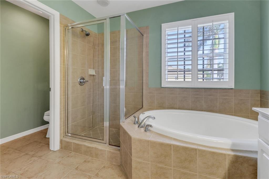 20000 Heatherstone Way, Unit 3 Estero, FL 33928 - Photo 22 of 44 a white bath tub sitting next to a shower