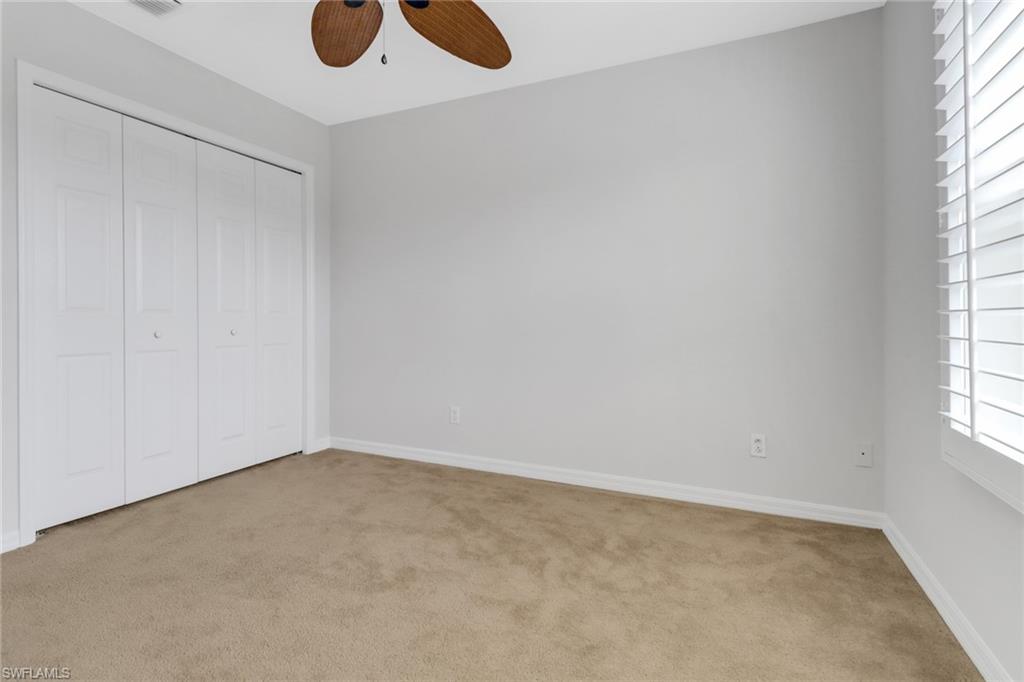 20000 Heatherstone Way, Unit 3 Estero, FL 33928 - Photo 24 of 44 an empty room with windows