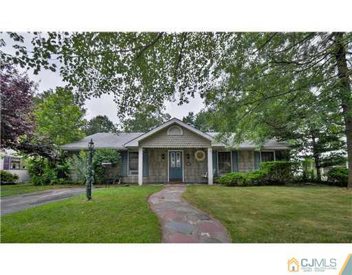 100 Winthrop Road Edison, NJ 08817 - Photo 1 of 18 a black and white house with a yard